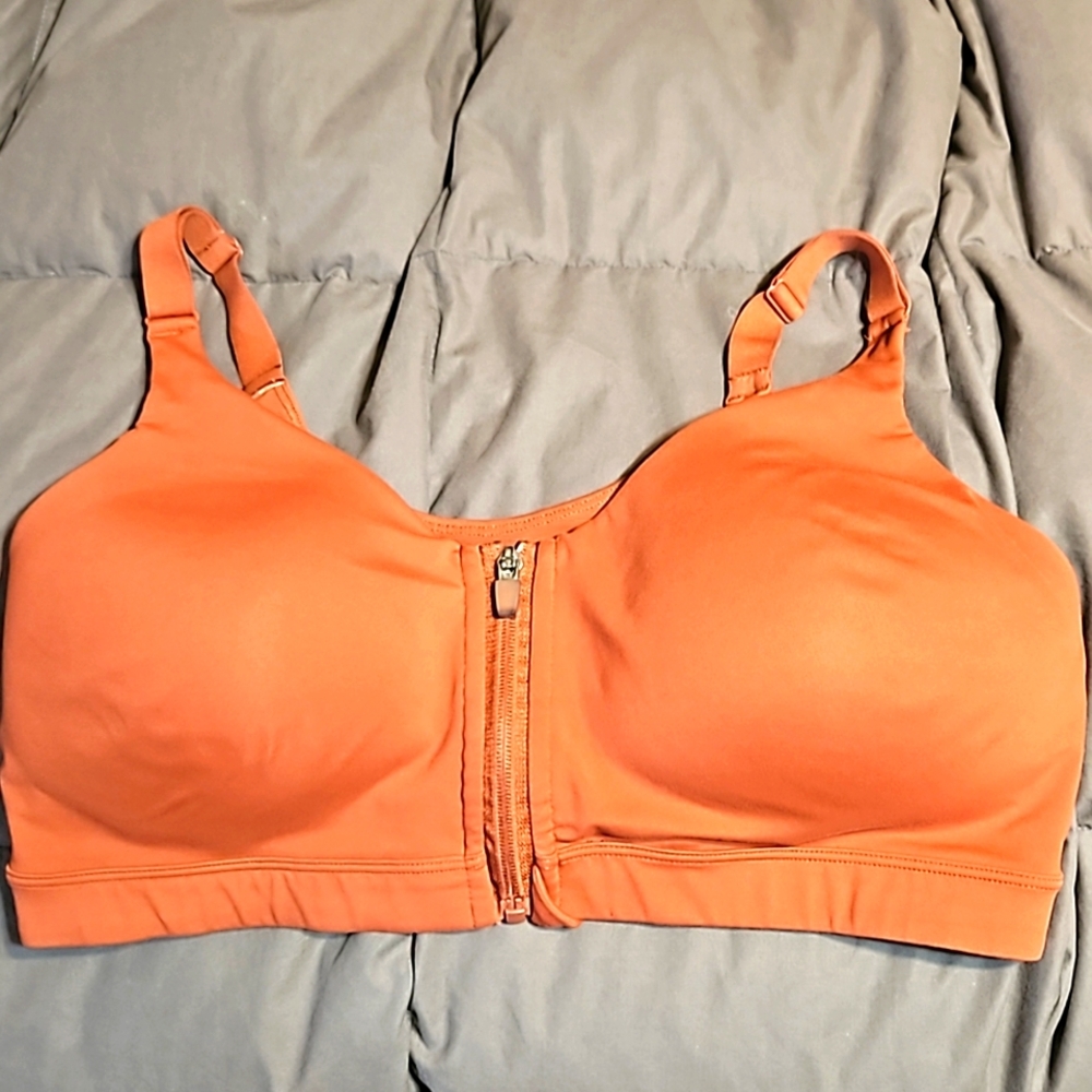 BURNT ORANGE Zip up sports bra size 38D.